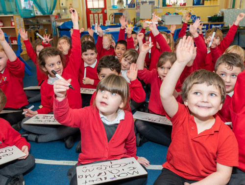Cononley Students with their hands up